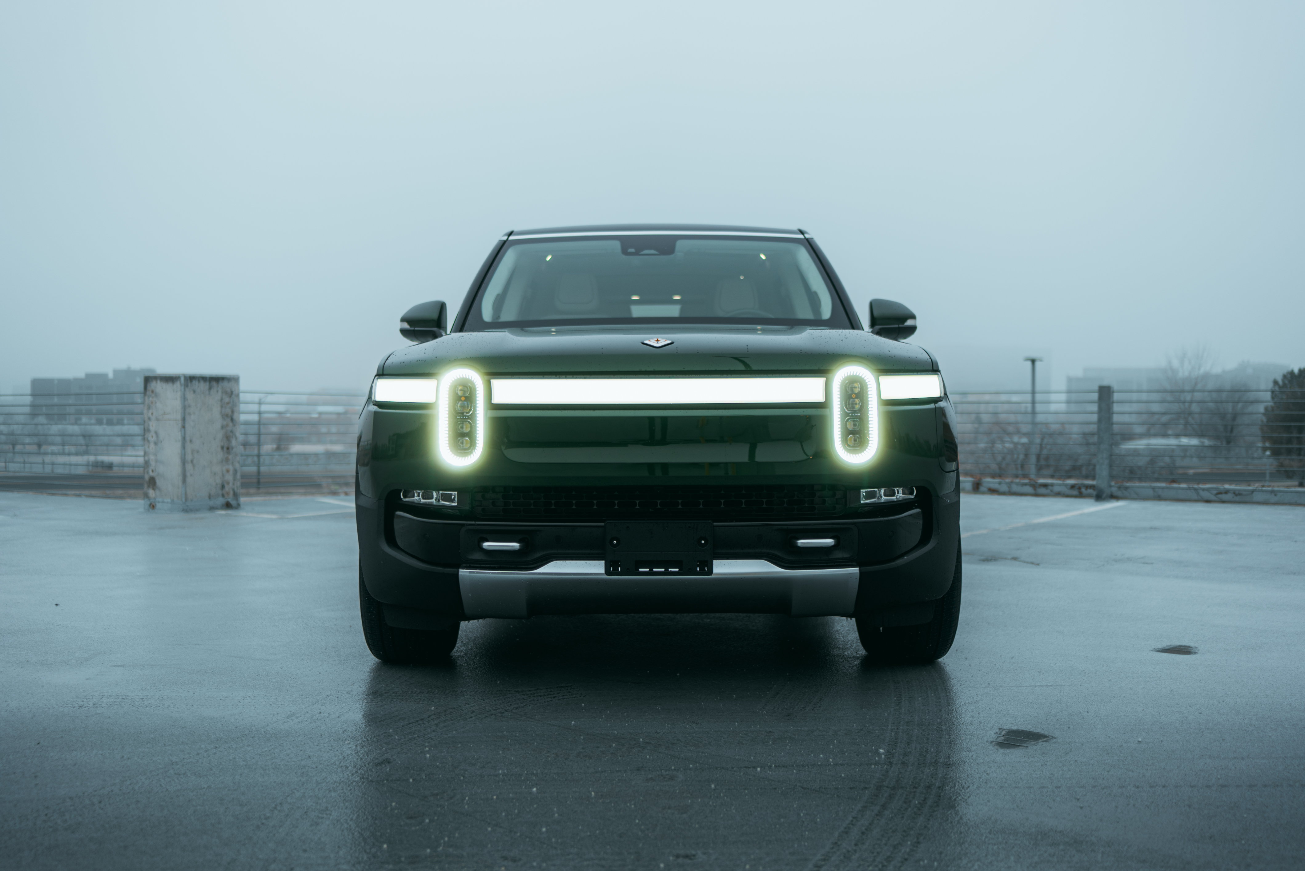 Green 2023 Rivian R1S Quad-Motor in the snow