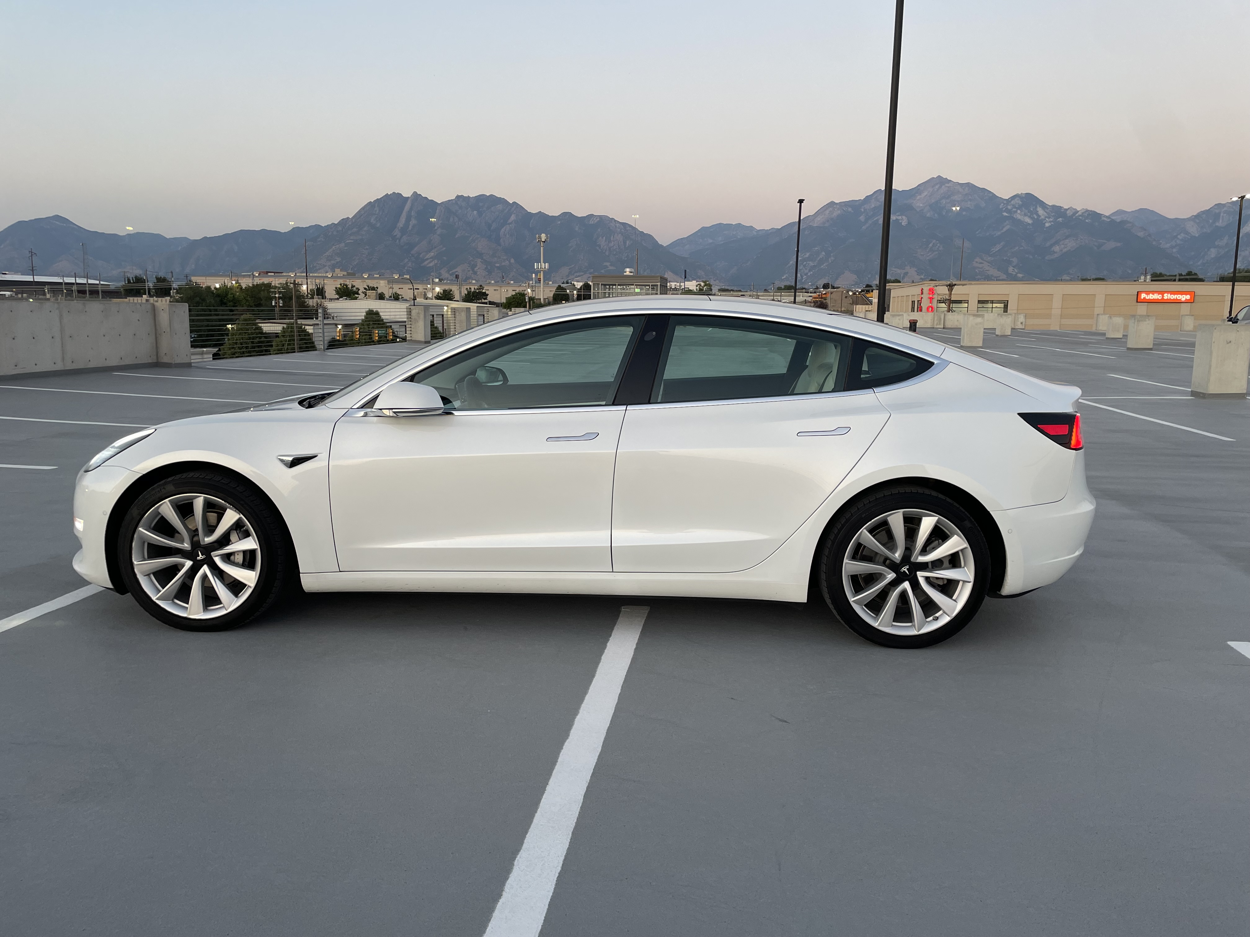 White Tesla Model 3 side profile